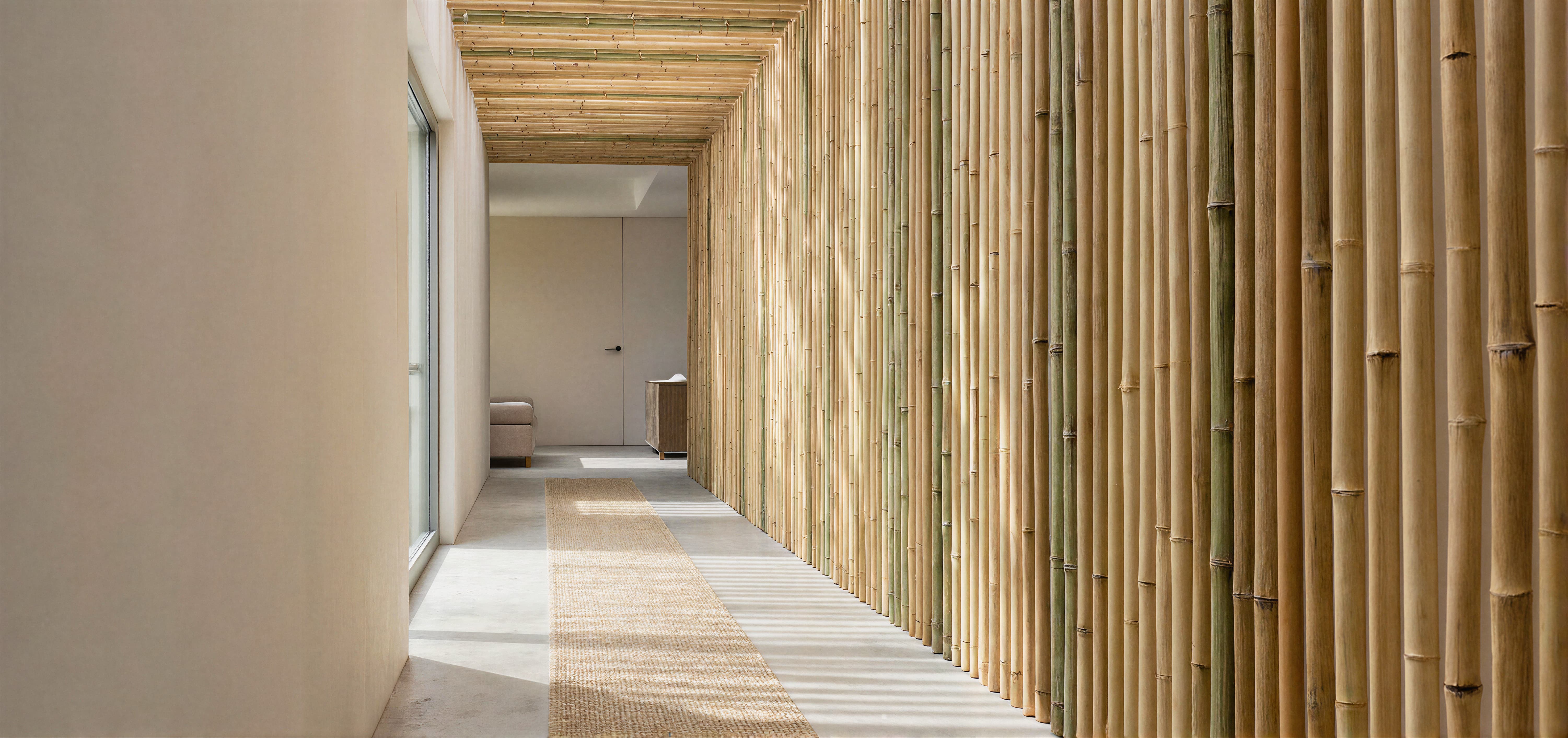 A calm healthcare corridor with neutral tones and bamboo walls