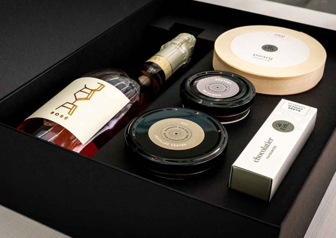 Selection of EHL products including Prosecco, chocolate, foie gras or lentil dal, chutney and shortbread biscuits