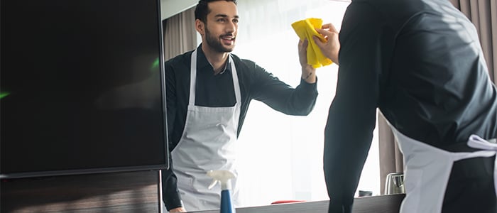 housekeeping staff cleaning room