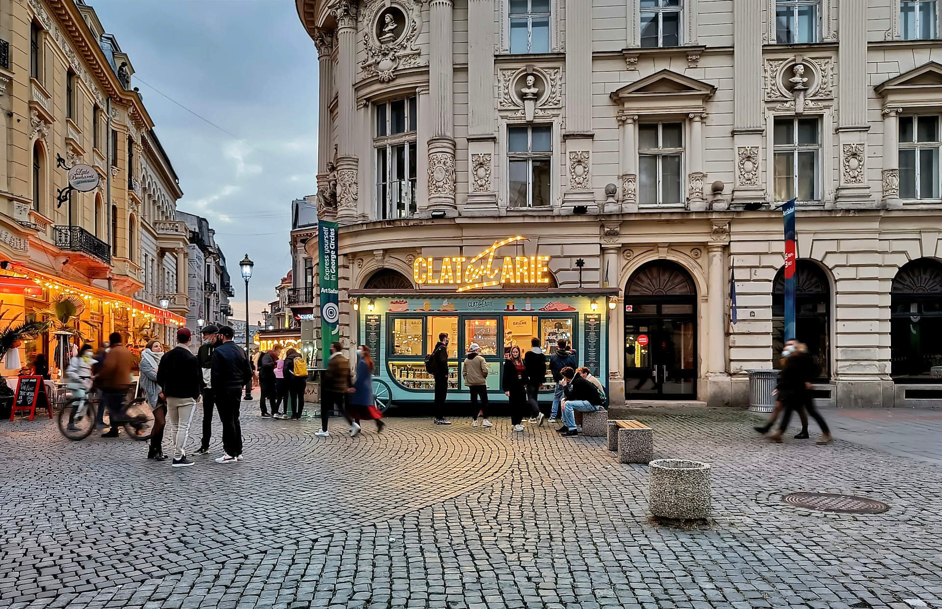 Cobbled European streets with restaurant options