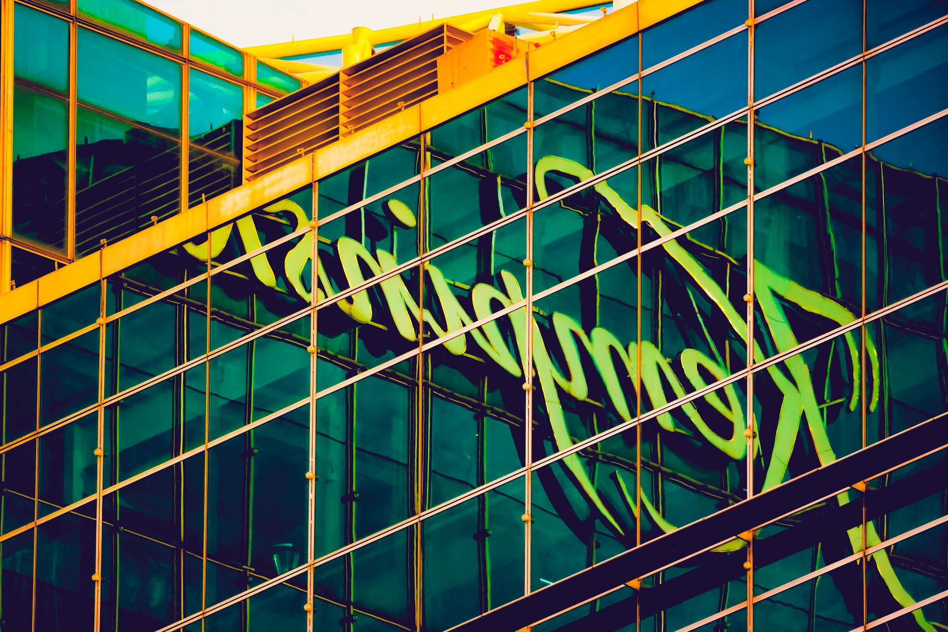 Kempinski logo reflecting on a glass facade