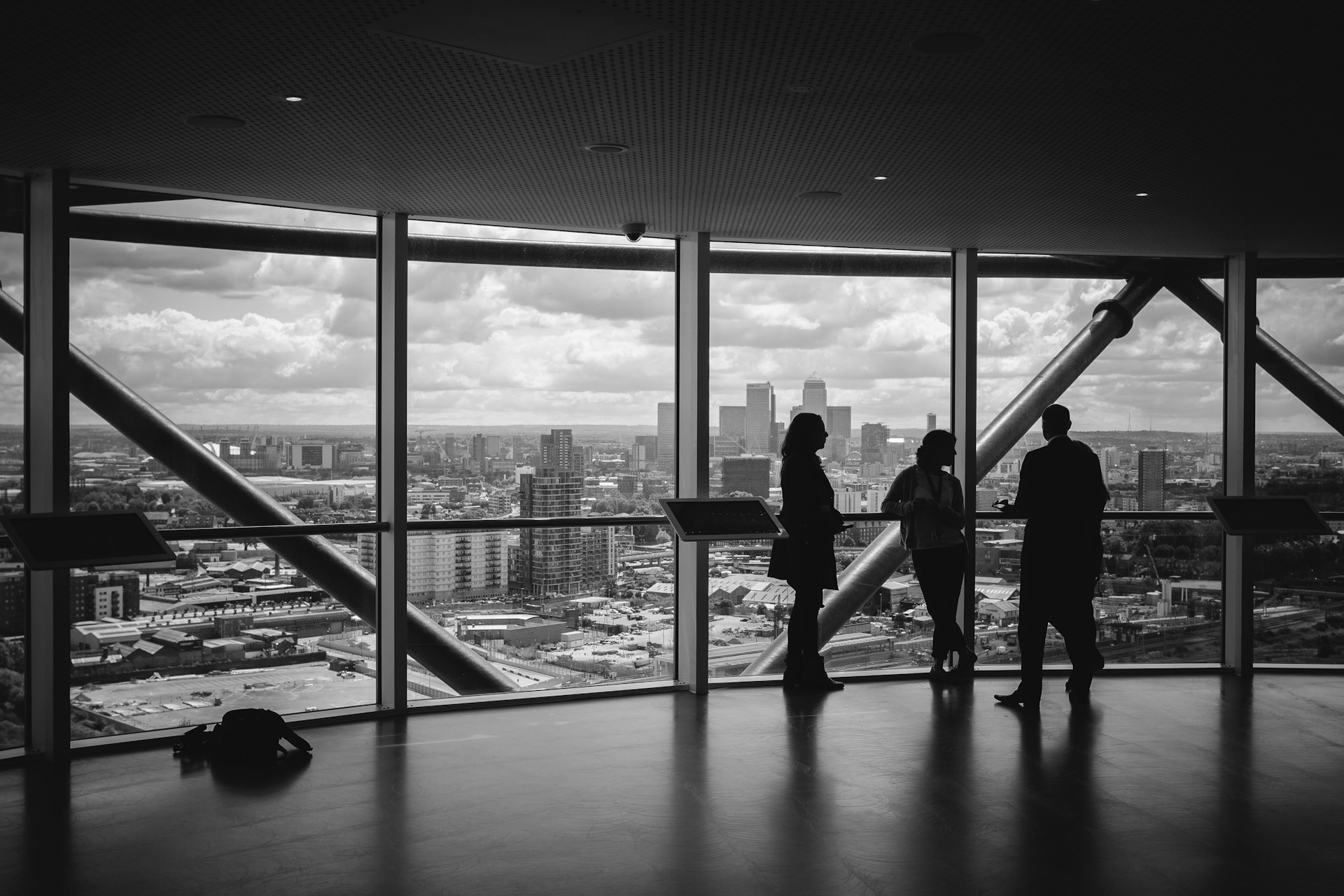 C-suite executive gazing into the cityscape all contemplative, like