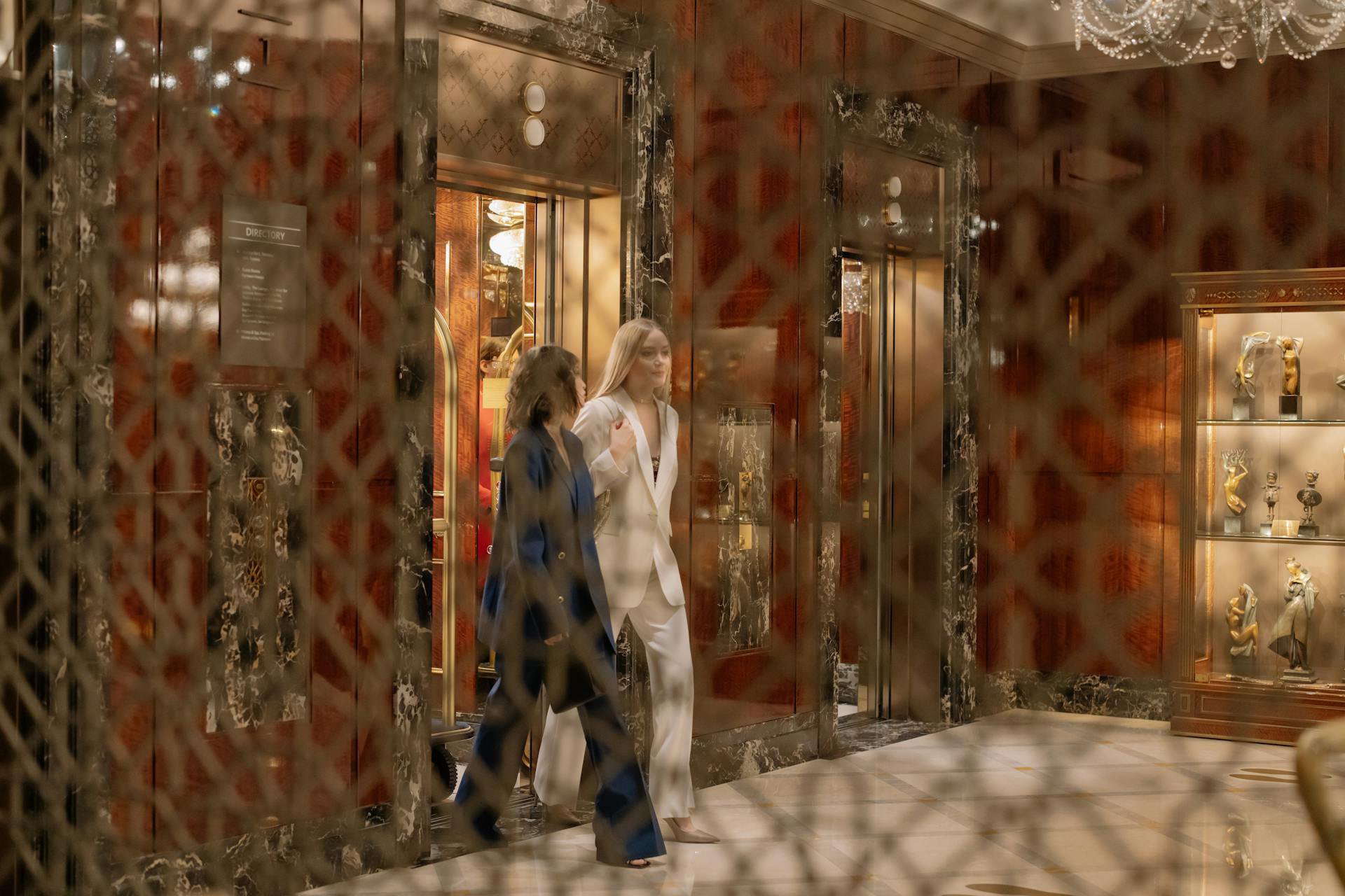 People exiting a hotel elevator
