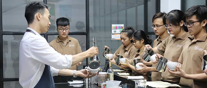 several individuals in a lab environment getting trained for service