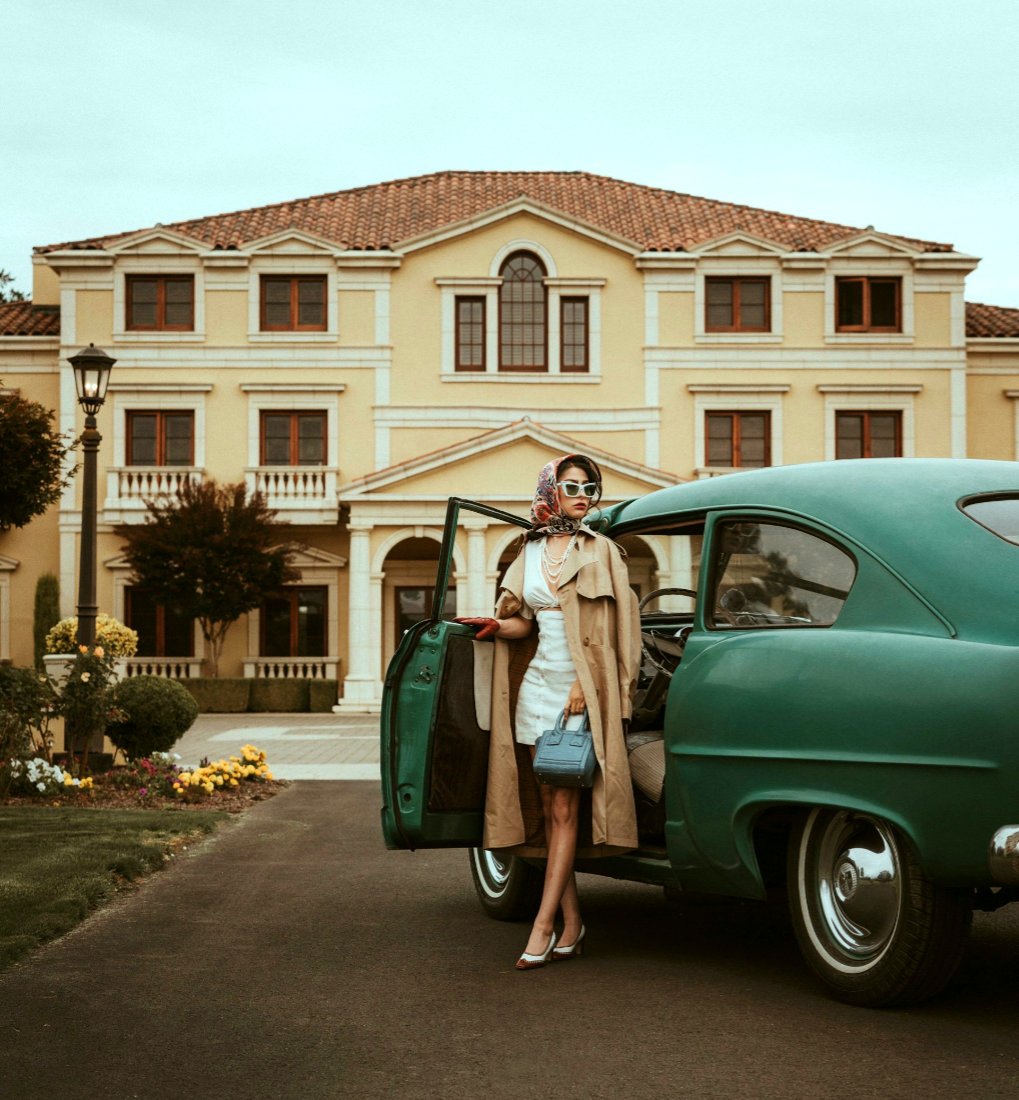 woman-stepping-out-of-vintage-car