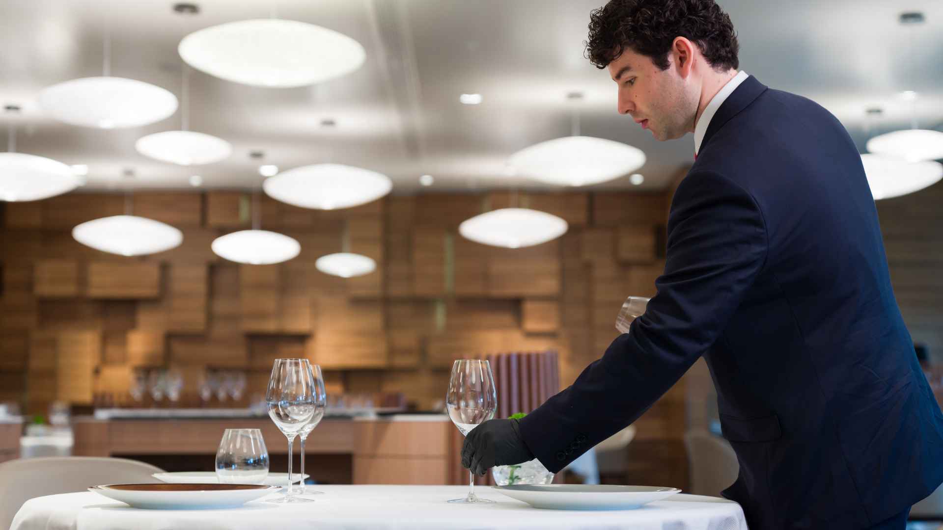 Students learning the basics of table setting at EHL Berceau des Sens